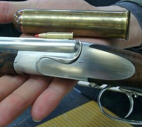 The Peter Hofer Hummingbird rifle with a .17 HMR cartridge and a .600 or .700 Nitro Express cartridge for comparison.