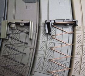 Left, a Magpul PMAG 30 follower assembly, compared to a AWM assembly, right 