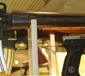 Note the wood-stocked rifle in the background: gold engraving, gold plated controls and gold plated magazine! 