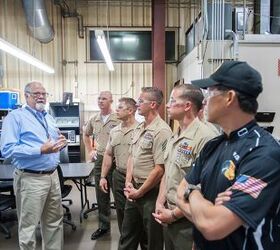 Leupold tour guide Rick (at left) is a company veteran who's been around the block a few times. 