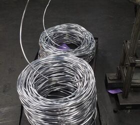 Individual loops of well bullets waiting to be cut as they are fed into another machine depending on whether it's a wadcutter or core.