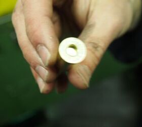 This brass case is in .303. It still has straight walls and the primer pocket is yet to be punched out.