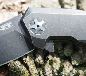 In this photo you can see the flipper at the bottom. When closed it shows about 3/8th of an inch sticking up. It makes the knife much easier to open.