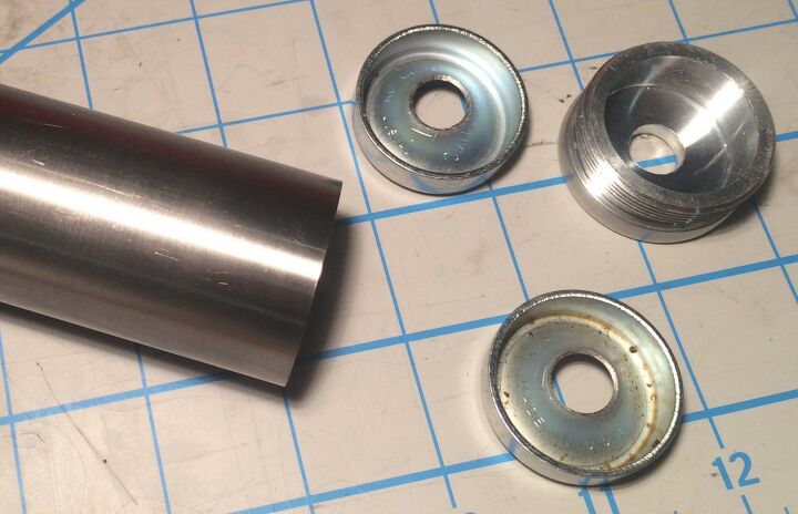 After: My 1.5 titanium tube with baffles formed from steel freeze plugs and an aluminum end cap. This is a short freeze plug build for a 9mm pistol.