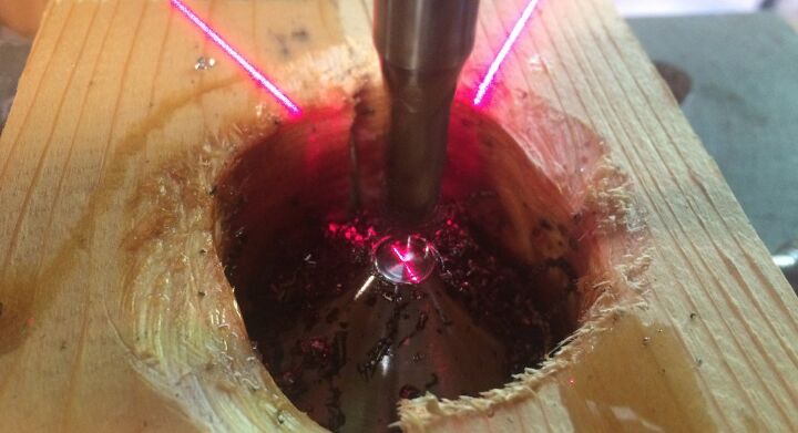 I'm drilling a bore in a titanium baffle using an end mill and dark cutting oil.