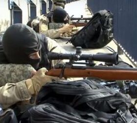 Members of PRF - Policia Rodoviaria Federal (Federal Highway Police) in a firing position with their AGLCs during an actual operation in Rio de Janeiro in August, 2016.