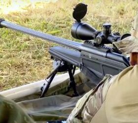 A Blaser Tactical 2 in range training use by a member of the Federal Police COT - Comando de Operacoes Taticas (Tactical Operations Command). The rifle's barrel shows the longitudinal cooling fins machined on its surface, the substantial muzzle brake being also evident.