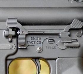 smith tactics battle bar ar15 bolt catch extended to the pistol grip