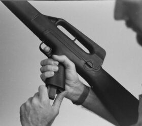 The magazine catch was located at the rear bottom of the pistol grip, being pressed forward to actuate.