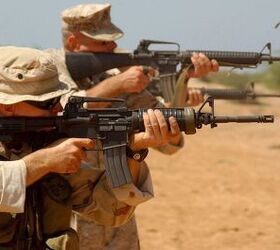 Original caption: 'DJIBOUTI-Sergeant Kris Floyd, chief coxswain with the Combined Joint Task Force - Horn of Africa Small Craft Detachment, fires the M-4 carbine weapons system during a two-day live-fire exercise here to improve weapons handling and marksmanship skills. The task force is here in support of Operation Enduring Freedom. Photo by: Corporal Paula M. Fitzgerald' The M4 Carbine is a variant of the M16 that was originally designed as a personal defense weapon, but which has since become a service rifle in its own right with both the United States Army and Marine Corps. Image source: commons.wikimedia.org