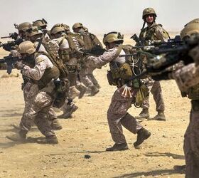 Original caption: '26th Marine Expeditionary Unit (MEU) Maritime Raid Force Marines fire M4 Carbines while conducting a marksmanship training exercise at a range in Qatar, April 22, 2013.' The M4 Carbine, like all assault rifles, is a versatile enough weapon to equip every member of an infantry squad. Image source: commons.wikimedia.org