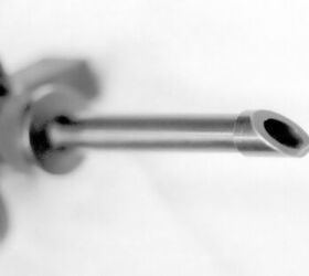 Like similar spoon-shaped compensators, the tiny one fitted to the Chilean gun was intended to direct muzzle gases so as to counter the SMG's muzzle climb tendency, mainly in full-auto. Similar devices can be found in several AK rifle variants, for instance.