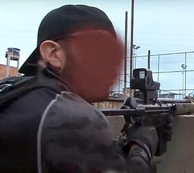 A retractable-stock 7.62x51mm Heckler & Koch G3 is seen here in action fitted with an EOTech holographic sight.