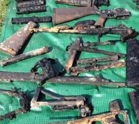Some of the guns pulled from the river by police divers, various bolts, magazines and barrels as well as a number of AR-15 stocks and a stock from a PARA FAL and the lower half of what looks like a French MAT-49 SMG. (ITV West Country)
