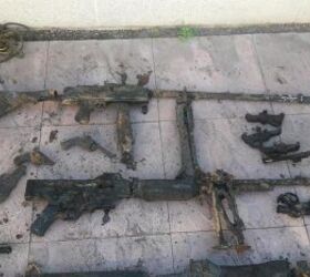 Some failed attempts to piece together the finds, resulting in a Bren-M1919 and a StG-BAR (News Group Newspapers Ltd)