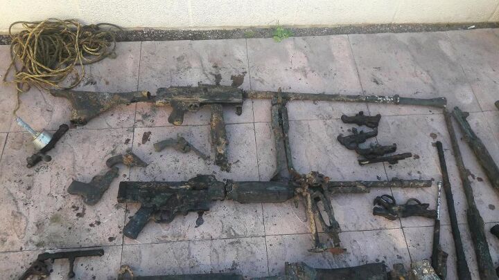 Some failed attempts to piece together the finds, resulting in a Bren-M1919 and a StG-BAR (News Group Newspapers Ltd)