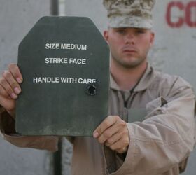 A US Marine corporal holds out the plate that saved his life. Modern rifle plates are lifesaving equipment for US servicemen, but they will increasingly find their way into the hands of our enemies as they become cheaper and more available. Image credit: United States Marine Corps, public domain.