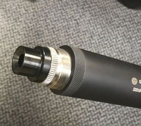 Sten SS suppressor attached to the ported barrel.