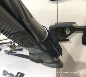 Notice the lighter colored stainless insert into the black aluminum action.