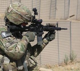 U.S. Army Staff Sgt. Chad Hart, an adviser with the 10th Mountain Division, fires his M4 carbine downrange at Khair Kot Garrison, Paktika province, Afghanistan, June 6, 2013 (US Army/SPC Chenee Brooks)