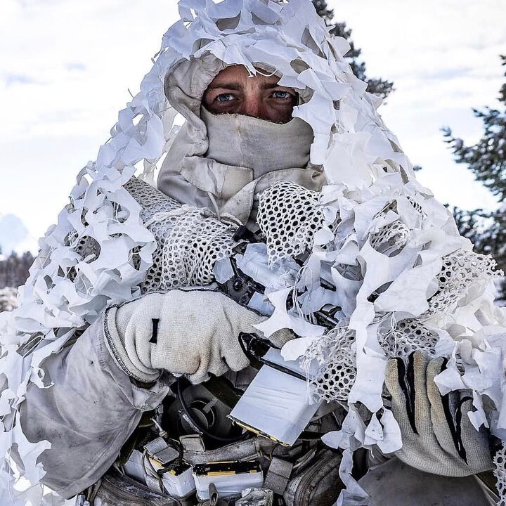 Snipers from 2nd Battalion The Parachute Regiment moving across open ground during Exercise Joint Viking.