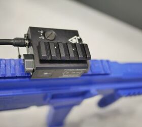 There is a segment of Picatinny rail that is attached to the top of the laser for the mounting of optics to the firearm-Miles V, Indo Defense 2018