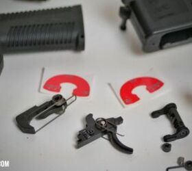 From Left to Right: B&T hammer and spring, the B&T Trigger and spring, binary selector unit, trigger pin spacer(s) and Franklin stainless safety detent