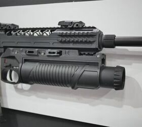 Latching the launcher to a Picatinny rail system is as simple as placing it on the rail and pressing down on the two latch points on the right side.-Miles V, Indo Defense 2018