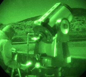 Photo of amateur astronomer with computer controlled telescope.