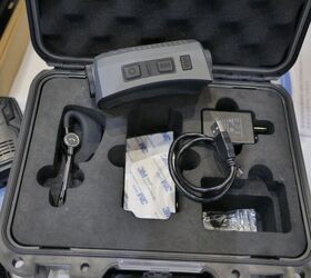 The camera comes in a foam formed hard case with all its accouterments and accessories. Note the 'SOS' button and USB slot, in addition to the recording button. -Miles V, Indo Defense 2018