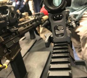 By dipping their head down, the shooter can see the iron sights built into the mount itself.