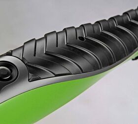 The forearm, cheeck pad and grip insert are designed to resemble the tire tread pattern of the tractor.