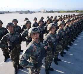 The second picture shows soldiers practicing with the new rifle