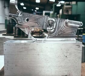 A newborn LSA lower sits atop a solid block of aluminum, like the one from whence it came.
