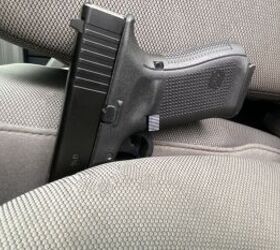 A great example of how jamming your gun into the seat is potentially very dangerous. The trigger is still exposed and unsecured.