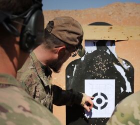 Coalition Forces analyze a zero target during a Smart Shooter sighting device familiarization range near At-Tanf Garrison, Syria, May 30, 2020. (DoD/Staff Sgt. William Howard)