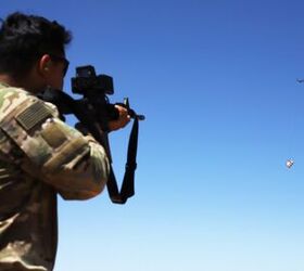 A Soldier fires at a box carried by a drone during a Smart Shooter sighting device familiarization range near At-Tanf Garrison, Syria, May 30, 2020. (DoD/Staff Sgt. William Howard)