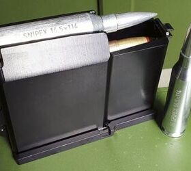 The 5-round magazine is fixed in the receiver via front and rear lugs.
