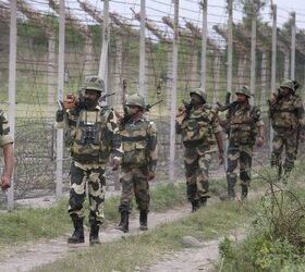 Troops from India's Border Security Force, part of the Central Armed Police Forces, on patrol, armed with both INSAS and AKMs (Indian BSF)