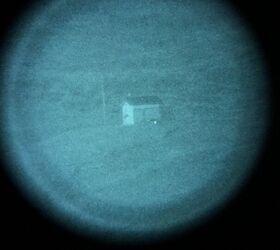 530 yards with Steiner SPIR illuminator turned on. You can see the fence a lot easier.