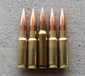 8.6 Blackout rounds compared to a .308 Winchester cartridge (in the middle)