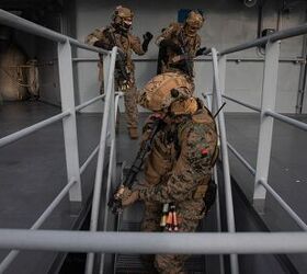 U.S. Marines from Charlie Company, 2nd Reconnaissance Battalion, assigned to 22nd Marine Expeditionary Unit clear the top decks of a ship during a visit, board, search, and seizure training mission in the Atlantic Ocean in support of exercise Northern Viking 2022, April 12, 2022. Northern Viking 22 strengthens interoperability and force readiness between the U.S., Iceland and Allied nations, enabling multi-domain command and control of joint and coalition forces in the defense of Iceland and Sea Lines of Communication in the Greenland, Iceland, United Kingdom (GIUK) gap. (U.S. Marine Corps photo by Cpl. Henry Rodriguez)