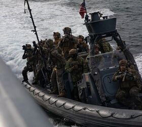 U.S. Marines from Charlie Company, 2nd Reconnaissance Battalion, assigned to 22nd Marine Expeditionary Unit prepare to board a ship for a visit, board, search, and seizure training mission in the Atlantic Ocean in support of exercise Northern Viking 2022, April 12, 2022. Northern Viking 22 strengthens interoperability and force readiness between the U.S., Iceland and Allied nations, enabling multi-domain command and control of joint and coalition forces in the defense of Iceland and Sea Lines of Communication in the Greenland, Iceland, United Kingdom (GIUK) gap. (U.S. Marine Corps photo by Cpl. Henry Rodriguez)