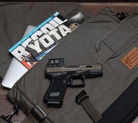 From this picture, it appears that LBT's courier bag includes a shoulder strap and will accommodate a pistol with optic, a MacBook, a small stack of poop, and a magazine about Toyotas.