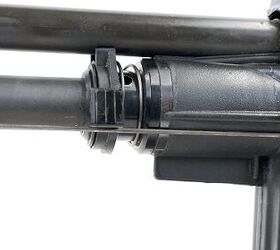 The trigger wire travels rearward under the handguard's left side bipod leg.