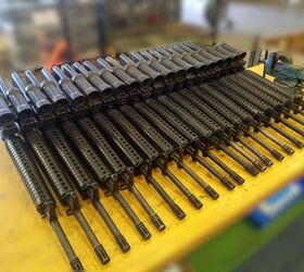A workbench filled with C7A1 rifles, with ELCAN optics, after being checked by armourers from the Royal Netherlands Army (via source)