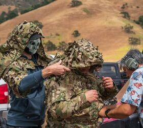 The bride's maid helps the bride with her veil. LOL