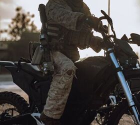 A U.S. Marine assigned to Reconnaissance Company, 15th Marine Expeditionary Unit, rides an MMX motorcycle in preparation for a raid during the ground interoperability exercise at Marine Corps Base Camp Pendleton, California, July 21, 2023. The ground interoperability training integrates Reconnaissance Company and supporting elements into a raid force to conduct land-based, specialized limited-scale raids in preparation for more complex amphibious and maritime operations. (U.S. Marine Corps photo by Cpl. Joseph Helms)