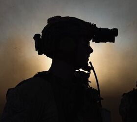 A U.S. Marine assigned to Reconnaissance Company, 15th Marine Expeditionary Unit, prepares to board an MV-22B Osprey attached to Marine Medium Tiltrotor Squadron (VMM) 165 (Reinforced), 15th MEU, before a raid during the ground interoperability exercise at Marine Corps Base Camp Pendleton, California, July 20, 2023. The ground interoperability training integrates Reconnaissance Company and supporting elements into a raid force to conduct land-based, specialized limited-scale raids in preparation for more complex amphibious and maritime operations. (U.S. Marine Corps photo by Cpl. Joseph Helms)