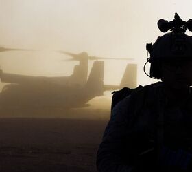 A U.S. Marine assigned to Reconnaissance Company, 15th Marine Expeditionary Unit, prepares to board an MV-22B Osprey attached to Marine Medium Tiltrotor Squadron (VMM) 165 (Reinforced), 15th MEU, before a raid during the ground interoperability exercise at Marine Corps Base Camp Pendleton, California, July 20, 2023. The ground interoperability training integrates Reconnaissance Company and supporting elements into a raid force to conduct land-based, specialized limited-scale raids in preparation for more complex amphibious and maritime operations. (U.S. Marine Corps photo by Cpl. Joseph Helms)